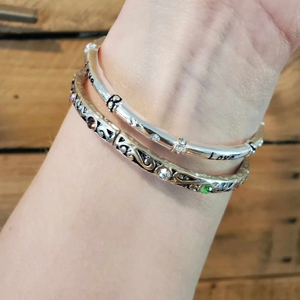 Set of 2 silvertone elastic bangles w/ pastel rhinestone details, love, hearts